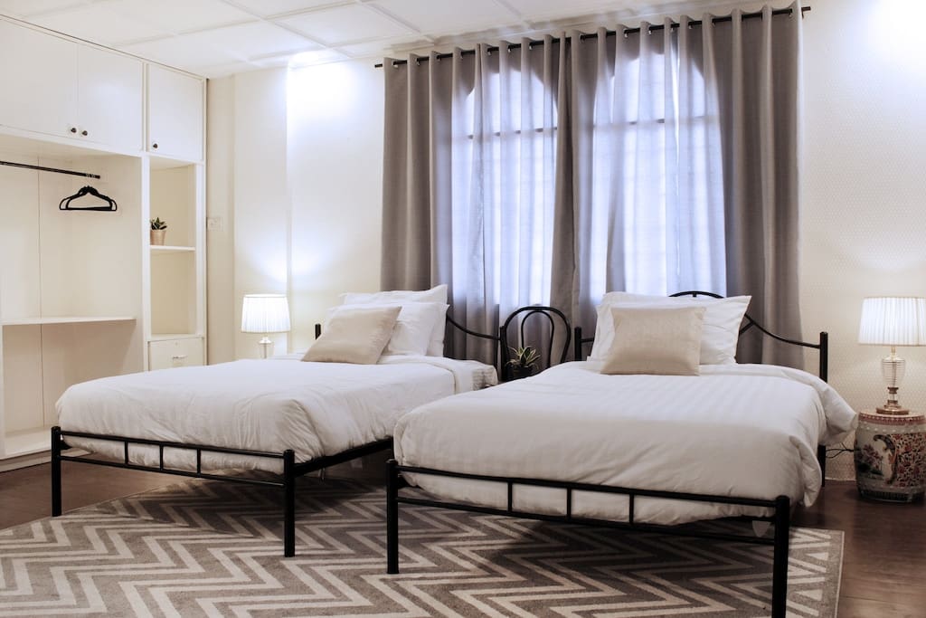Sage Bedroom - Two semi-double sized beds with en suite toilet and bath