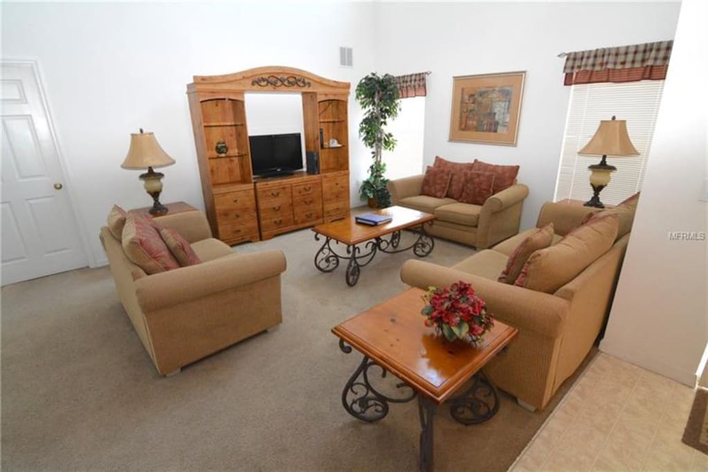family room with patio doors leading to pool.