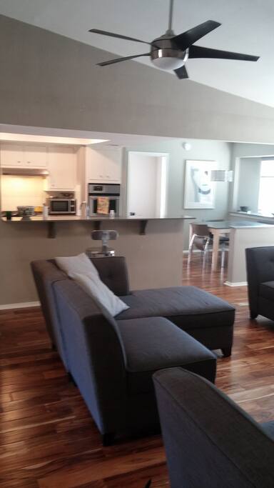 main living room, with adjacent kitchen and dining area