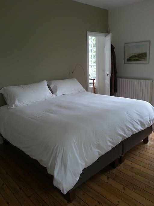 Master bedroom with entrance to ensuite bathroom