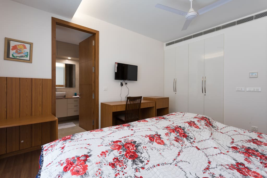 Another view of the bedroom with the door to the bathroom