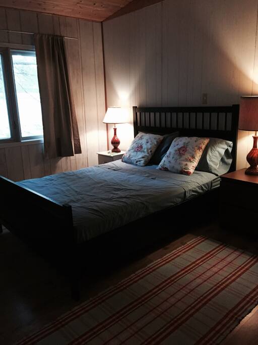 One of the bedrooms with a queen size bed