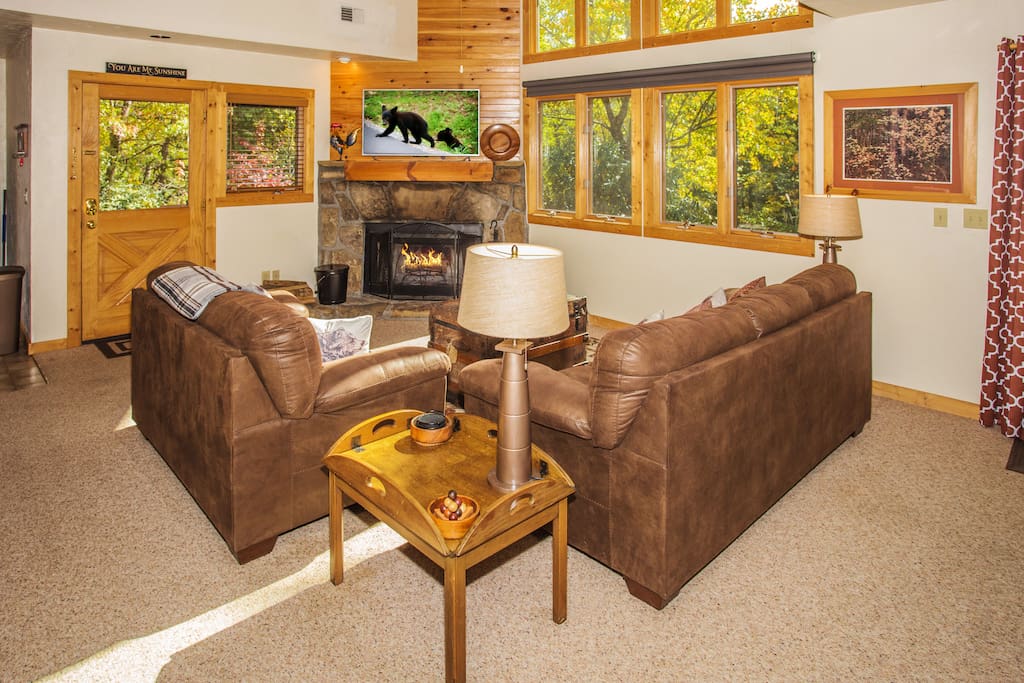 Cozy up in the plush sofas next to the fireplace.