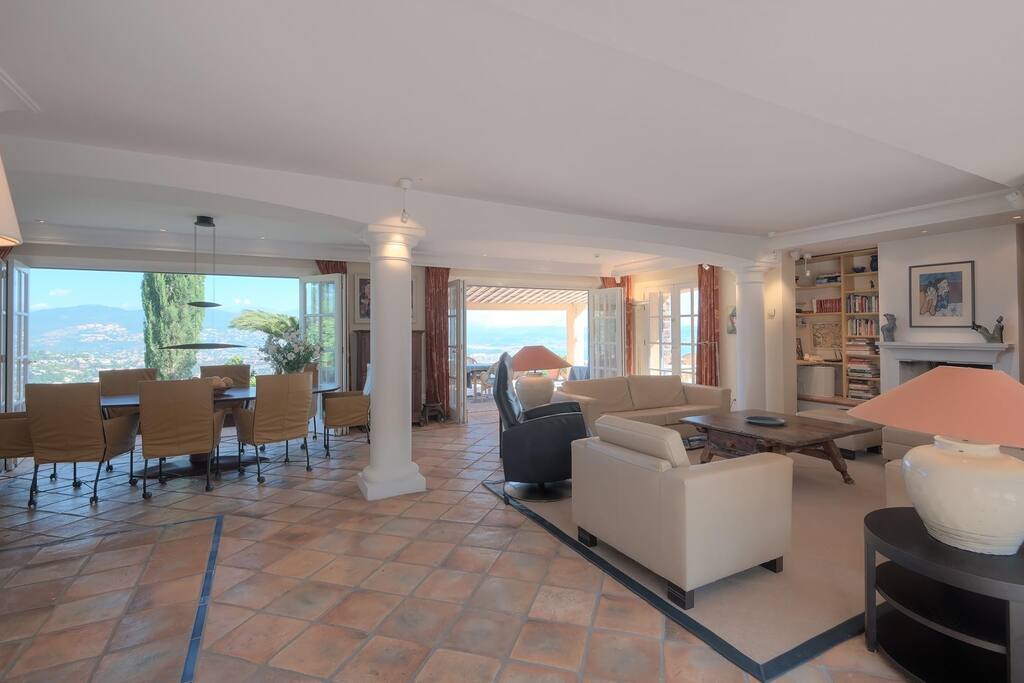Spacious living room, fireplace, dining. Opens up on both sides of the room.