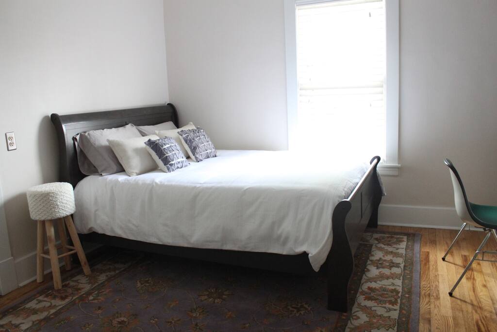 Second bedroom with queen bed and plenty of natural light
