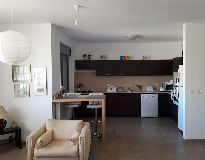 Fully equipped kitchen, Toaster, Kettle, Large fridge and all the utensils you`ll ever need to cook a feast!
The kitchen has sit down balcony with a plastic table suitable for 4-8 people facing west and very suitable for breakfast in the cool Jerusalem air.