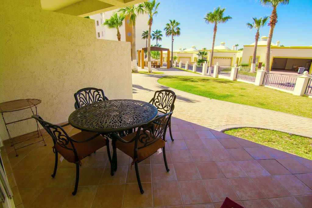 Chair,Furniture,Patio,Building,Palm Tree