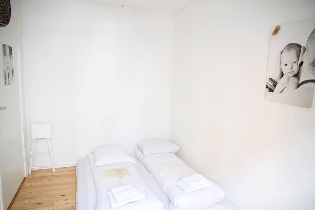Your sleeping room with space for two. It is a "byklipklap" futon (danish design) with fluffy feather duvets and white sheets and towels.