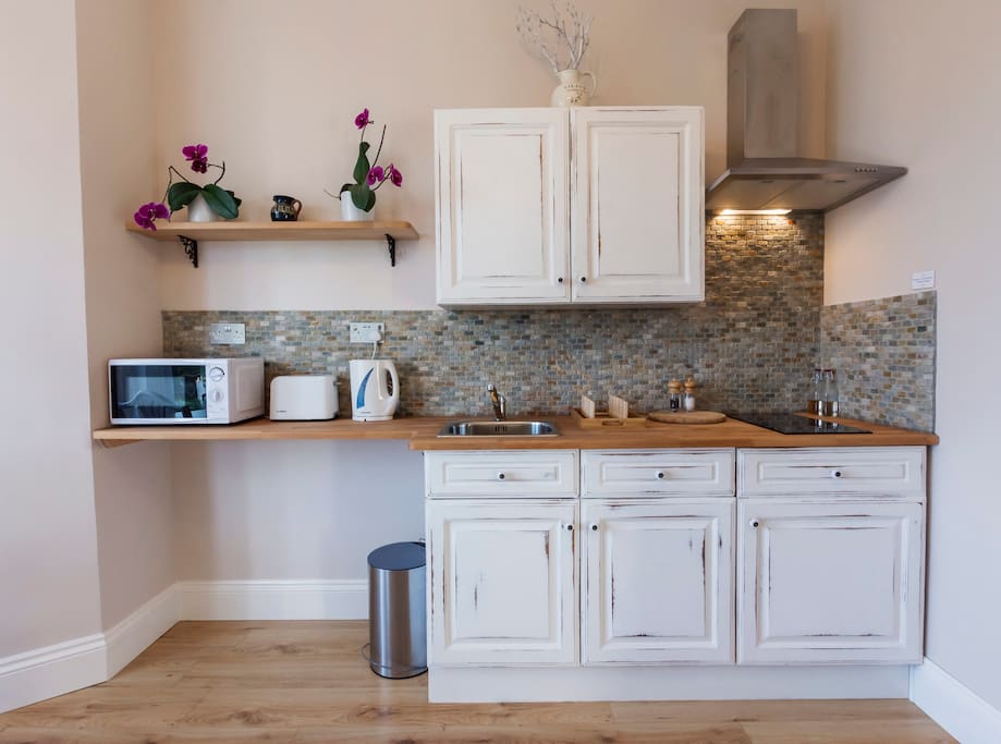 Kitchenette - equipped with a kettle, toaster, microwave, stovetop, sink, pots & pans and utensils, crockery and cutlery. We also provide complimentary tea/coffee and some cooking essentials.