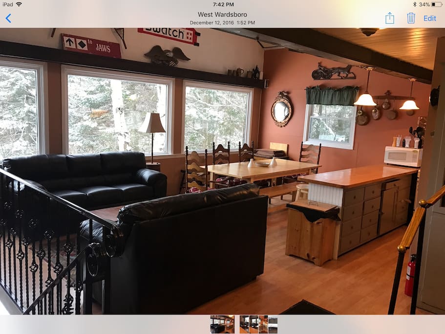 Second floor has open floor plan for dining, cooking, and relaxing. Large windows offer exceptional views of the slopes at Mount Snow.