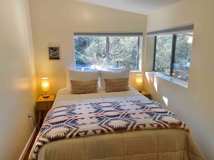 Bedroom 1 
Bedroom 1 has a separate bedroom w/queen bed, and a living room suite with a sofa that converts with a topper to a comfy bed w/big screen tv.  Bathroom 1 is in this large suite that perfectly accommodates 4 guests.  Locking privacy door.