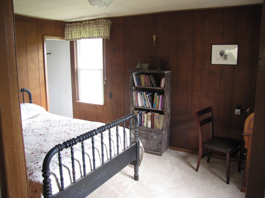 Master bedroom: double bed, roll top desk, bookcase and closet
