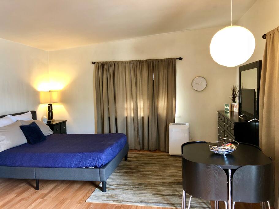 Queen bed, ac unit, large dresser, Roku tv, small table for 4