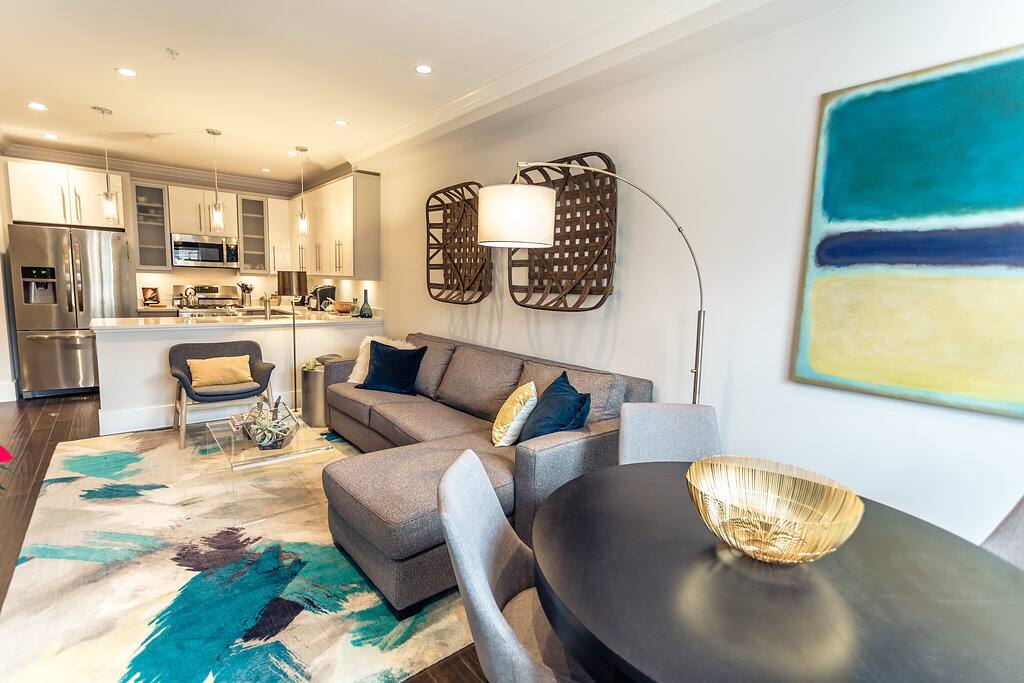 Inviting and open living room, dining room, with kitchen combo
