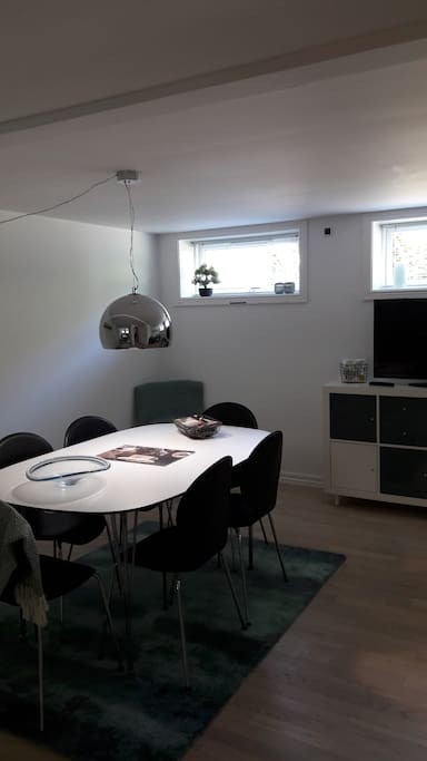 Living room with dining table (6 pax) and TV.
