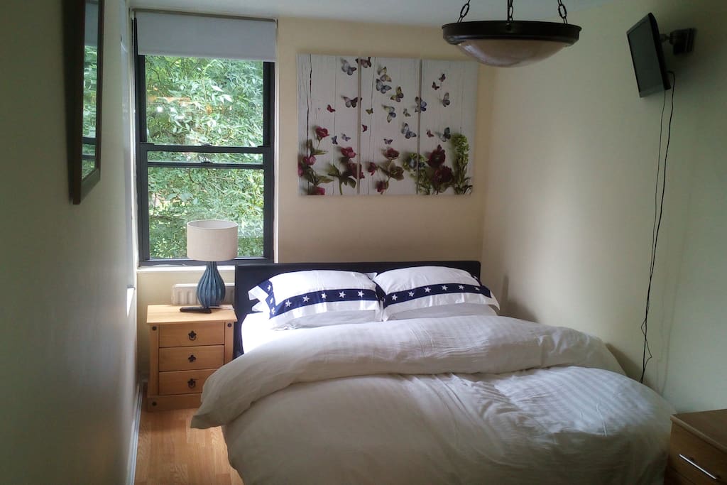 Large airy bedroom with kingsize bed.