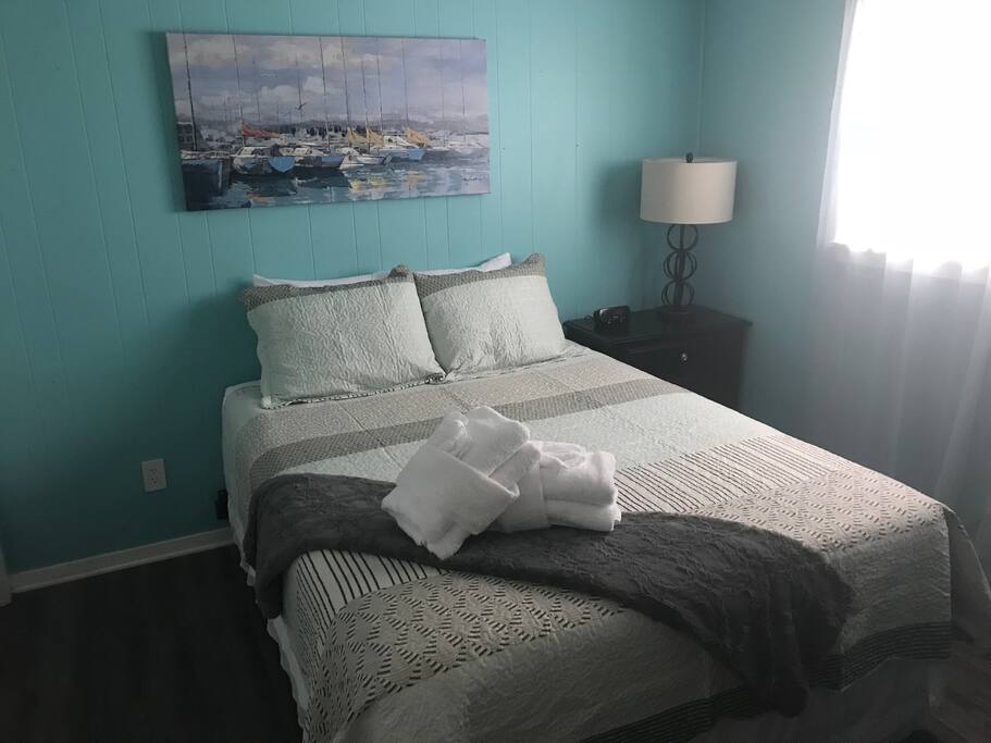 Master bedroom features a queen sized bed.