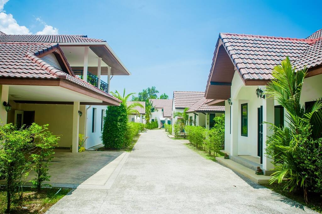 House on the left side, parking area