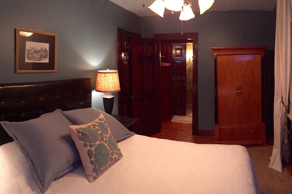 Small closet between bed and Bath areas. Cabinet to the right holds small fridge, microwave and coffee maker.