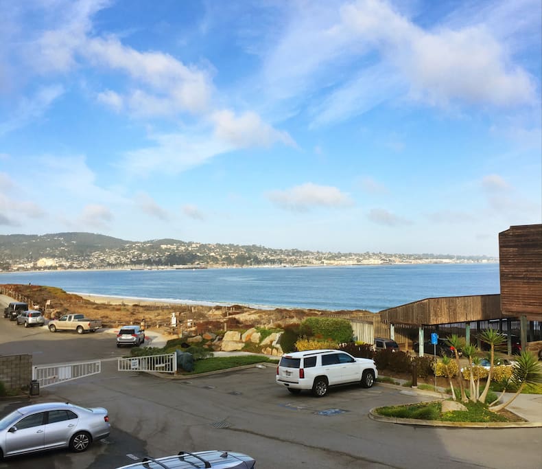 View from balcony looking over Monterey bay onto downtown and Pacific Grove.