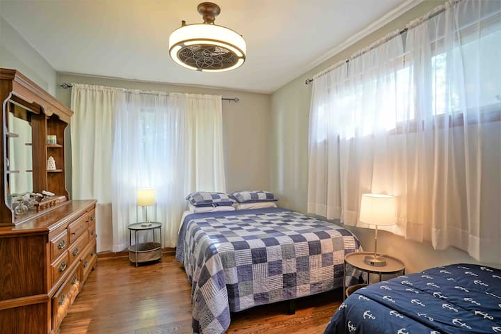 Lighthouse Bedroom with lake view. Sleeps 3. Features full size bed and twin size bed. Remote controlled ceiling fan.