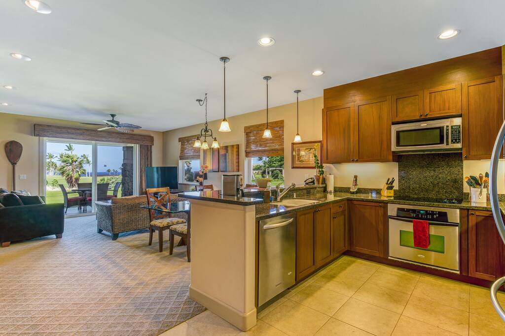 Kitchen and living room. The dining table has seating for 8.