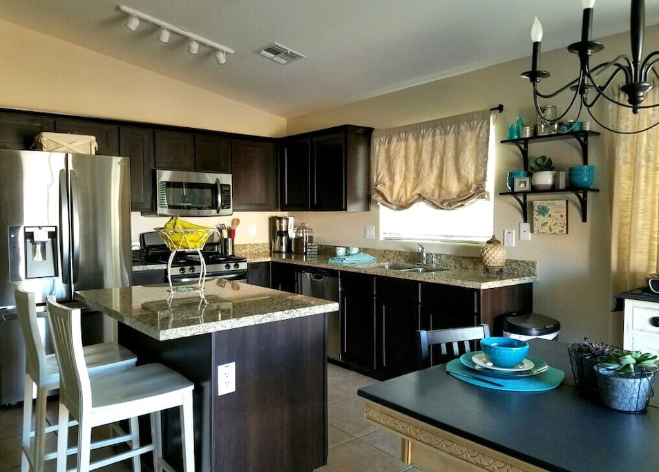 Decorator colors with stainless appliances and granite countertops.