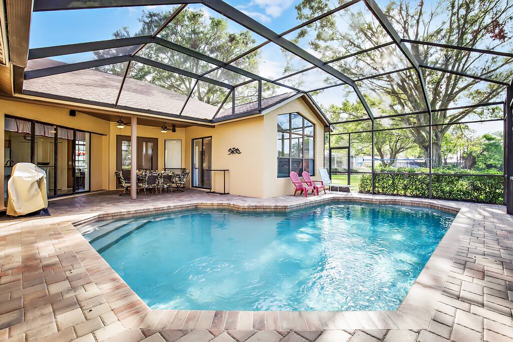 Large tiled pool area and pebble tech pool
