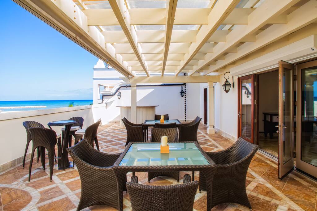 The second floor deck has a hot tub, grill and plenty of seating capacity.