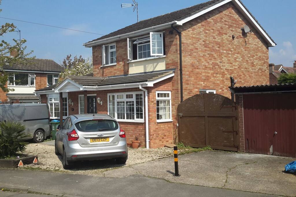 The extended detached house with ample parking at front