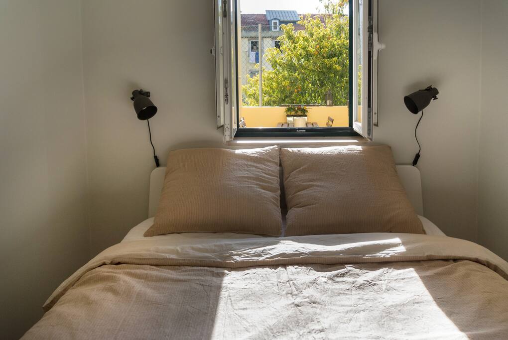 Bedroom on patio side, with afternoon and evening sun.