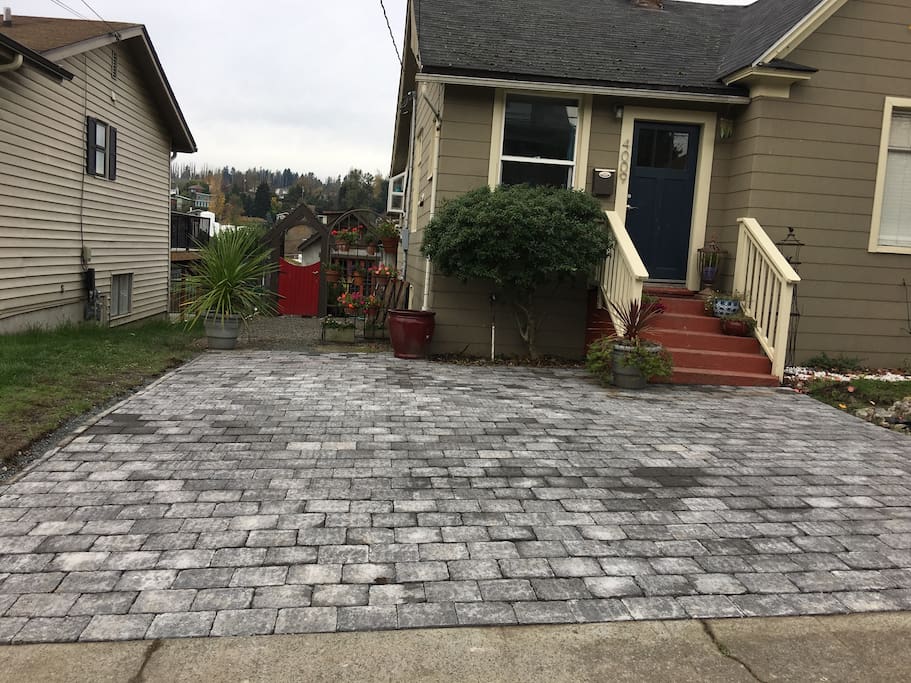 Off street parking driveway/courtyard. Entrance to the cottage through the red gate