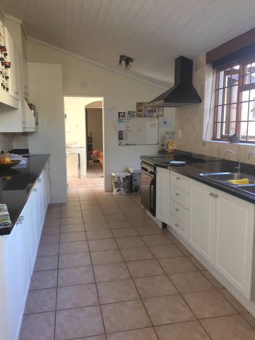 Kitchen which has access to laudry and outside area
