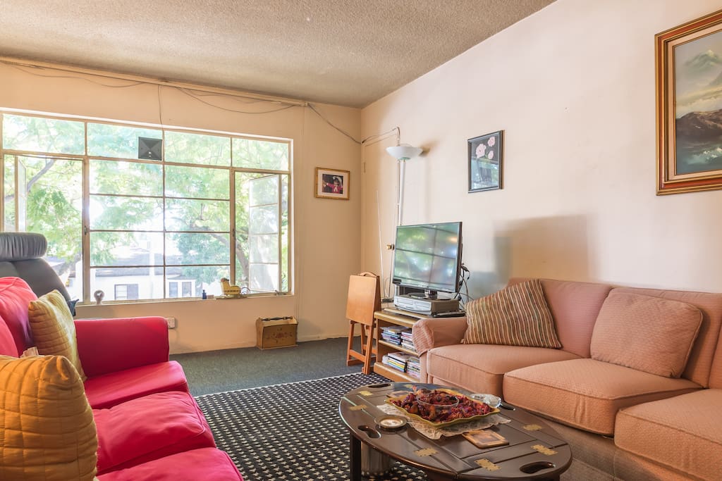 The Center of the huge Living Room/Dining Room combination showing the HUGE bay window