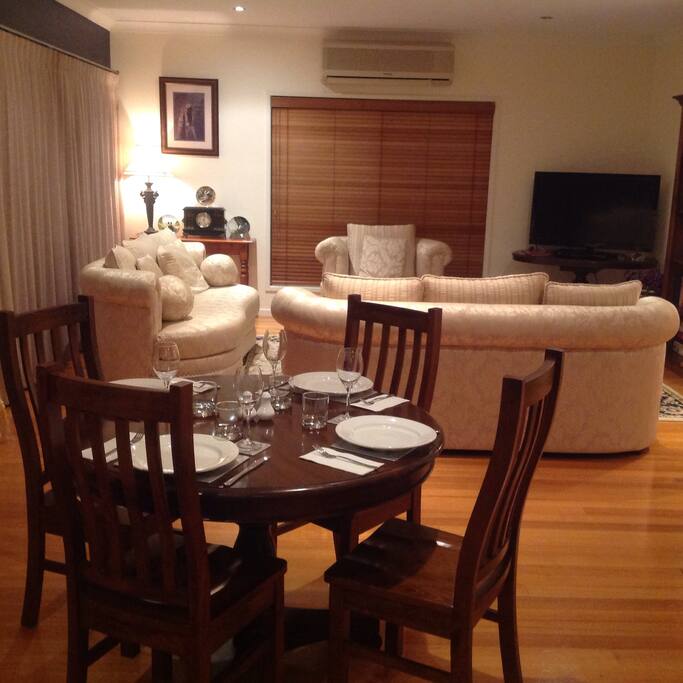 Beautifully appointed lounge and dining room: Features include wide screen TV, DVD library, and deep comfy lounge.