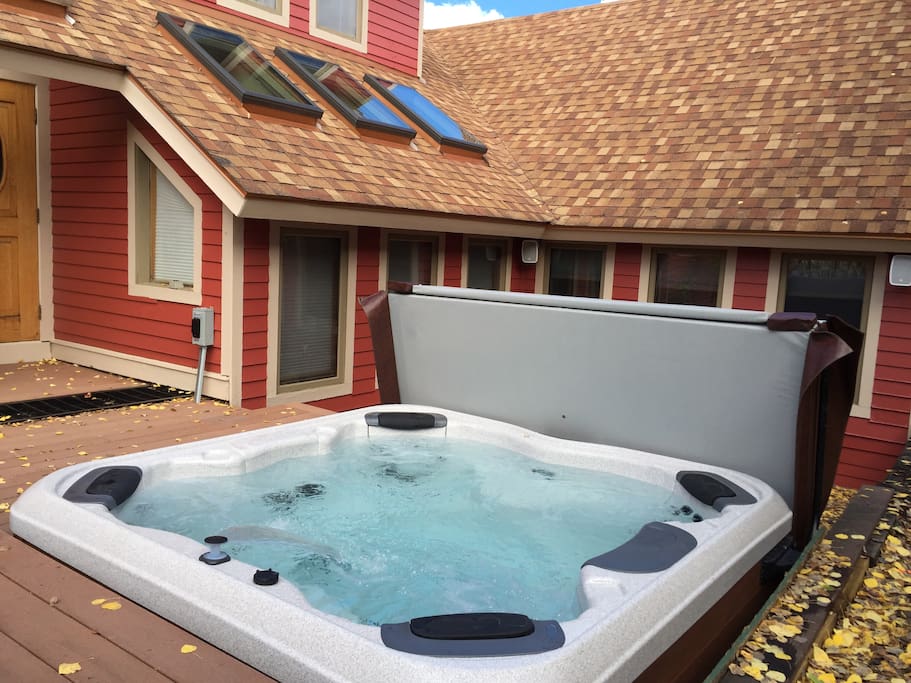 Private recessed Bullfrog Spas hot tub just steps from the door