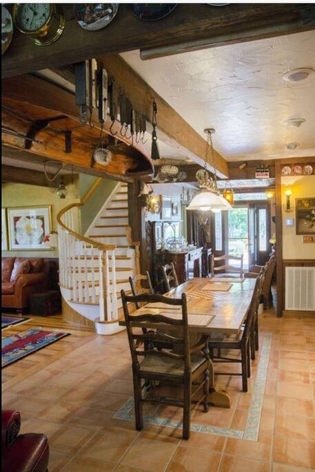 Kitchen table with the stairs to upstairs.