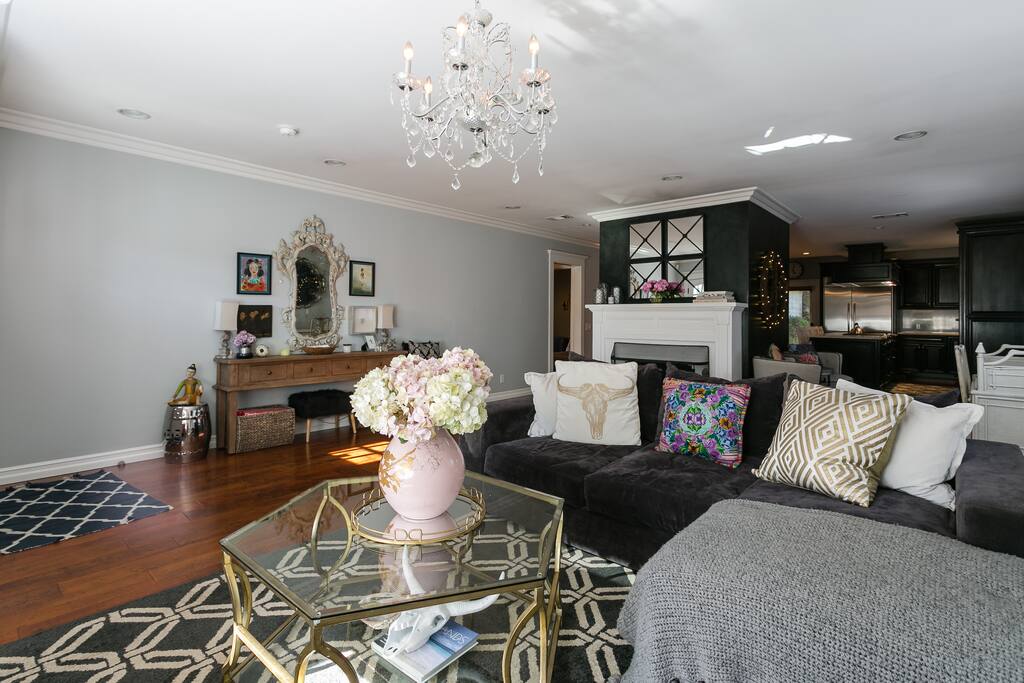 A view from the living that shows the fireplace and entry table