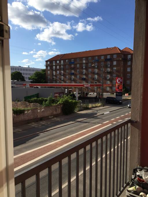 Balcony with a view to Tivoli’s tower and a 24/7 gas station