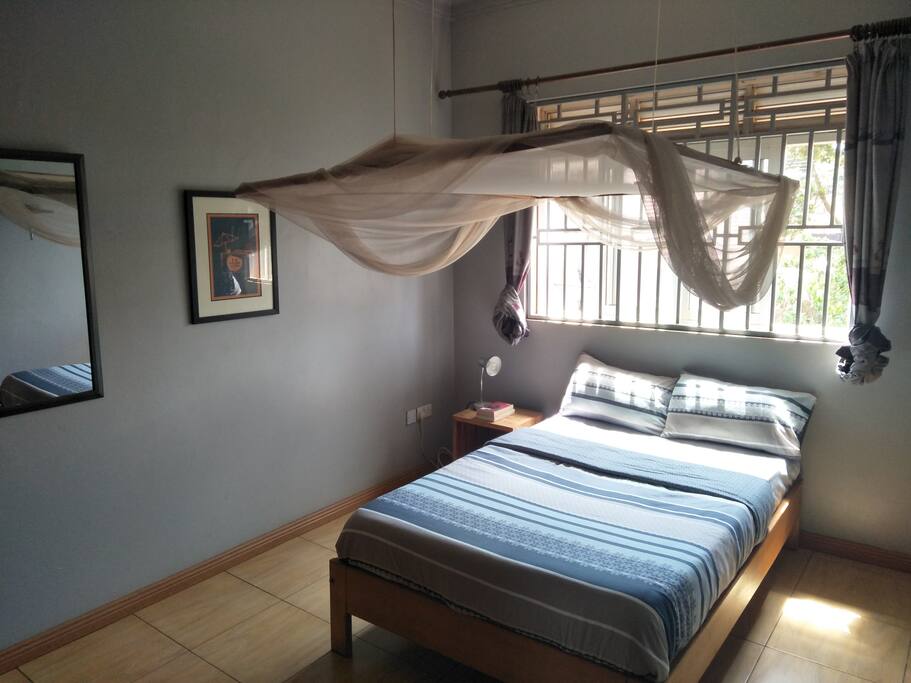 Tidy room with double bed and full of light