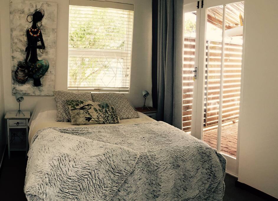 bedroom doors lead to the courtyard.Off-street parking is behind this gate or park outside the gate