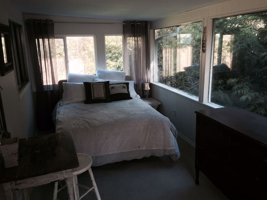 Bright and clean private suite with attached screened porch.
