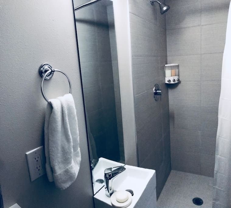 Your private shower, with essentials such as Shampoo, Conditioner and Body Wash, soap and towels.