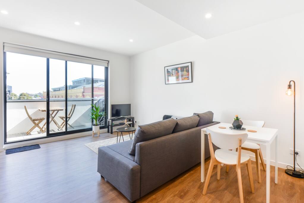Lounge with seating for three and dining table for two