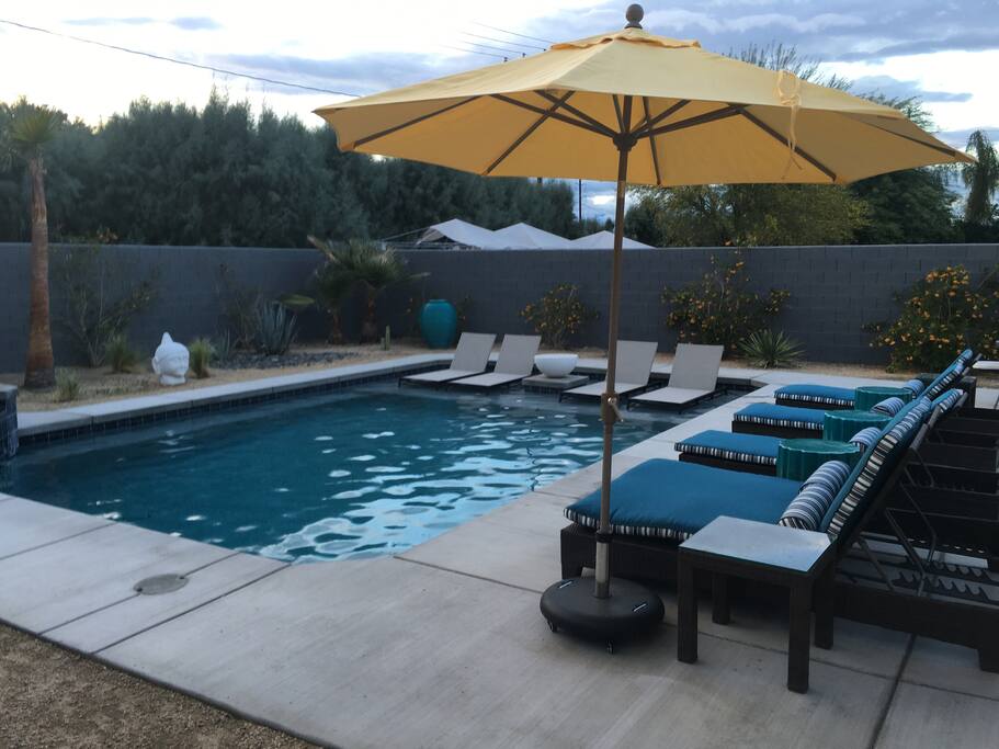 Plenty of comfortable lounging space by the pool.