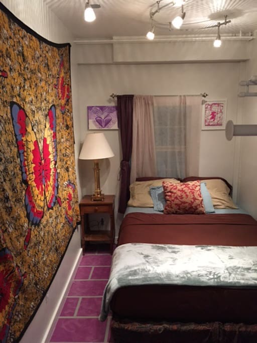 Small bedroom (queen-sized bed, not pictured: rack for hanging clothes, full-length mirror, small stool)