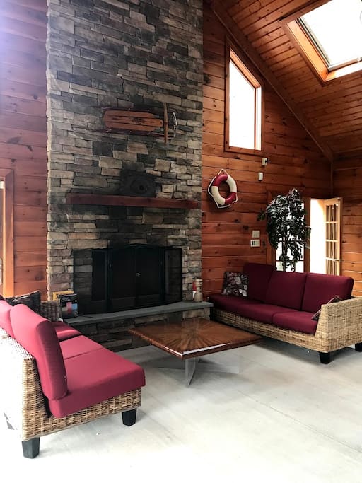 Pool room living area with gas fireplace