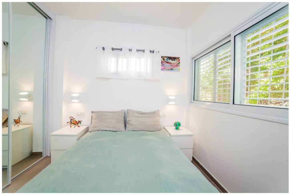 Cozy bedroom overlooking trees