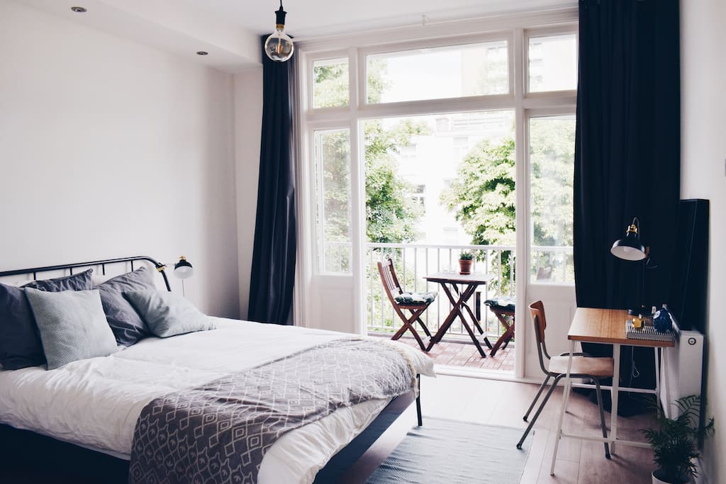 Master bed with sunny balcony