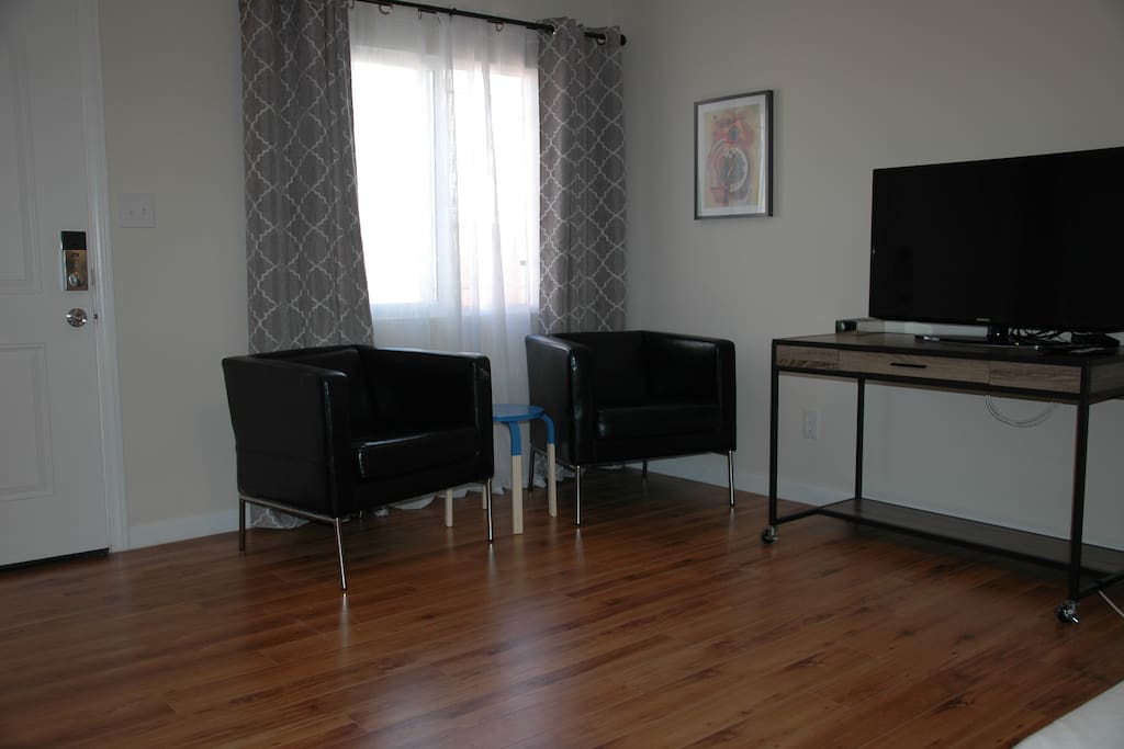 Armchairs and work space. HDTV with streaming grade internet